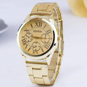 Detailed side view of Geneva gold tone quartz watch with Roman numeral dial and link strap