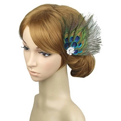 Detailed side view of a peacock feather fascinator with rhinestones on a mannequin
