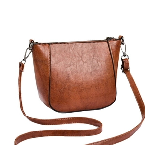Brown retro leather tote bag with pebble texture and adjustable silver shoulder strap