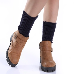 Women's cable knit leg warmers in navy blue styled with brown ankle boots