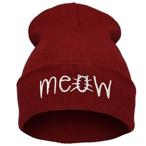 Detailed white Meow cat embroidery on a burgundy knit beanie cap with high quality texture