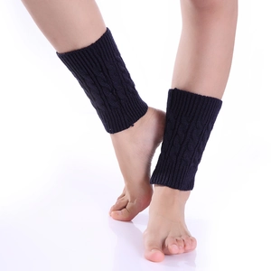 Detailed cable knit pattern on navy blue leg warmers made of soft knitted fabric