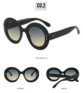 Vue détaillée des lunettes de soleil ovales noires avec verres dégradés bleu-jaune