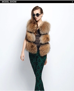 Detailed model shot of brown faux fur vest with horizontal stitching and layered design
