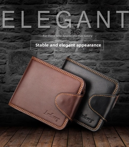 Close-up of black and brown leather bifold wallets with contrast stitching and buckle closure