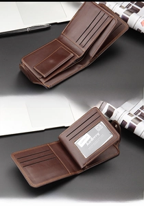 Detail of dark brown bifold wallet with card slots, ID window and contrast stitching