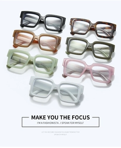 Macro detail of various fashion square oversized anti-blue light glasses in multiple colors