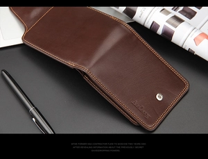 Detailed view of the brown leather texture and Baellerry logo on a business wallet
