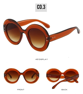 Trois angles de lunettes de soleil ovales en écaille avec monture ambre et verres