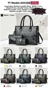 Detailed set of embossed leather handbags with floral patterns and internal storage view