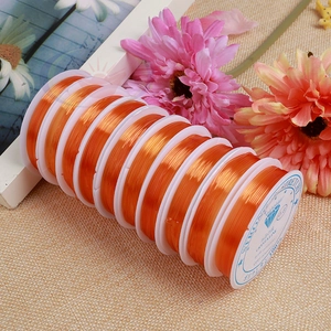 Detail of 0.8mm orange elastic polyurethane cord rolls for DIY jewelry making