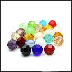 Close-up of faceted 14mm crystal butterfly pendants in various vibrant colors for jewelry DIY