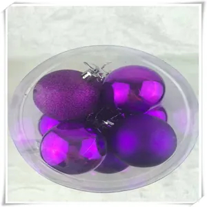 Close-up of purple Christmas ball ornaments set with matte, glitter and shiny finishes