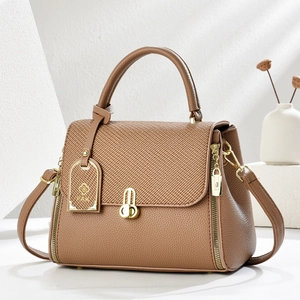 Brown large capacity leather tote bag with fabric panel and golden hardware details