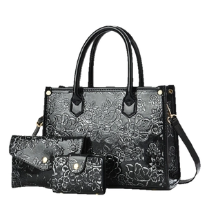 Three-piece black summer handbag set featuring detailed 3D rose floral embossing