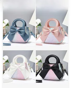 Detailed macro view of gradient leather texture and large bow on the stylish handbag