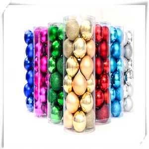 Detail of 3cm Christmas balls with matte and glitter finishes in cylindrical packaging