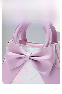 Detail of lavender gradient handbag featuring a large leather bow and floral pattern