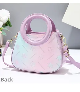 Rear view of floral gradient handbag featuring purple leather strap and gold hardware
