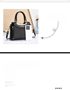 Detail of black PU tote bag with woven texture, gold handles and phone for size scale