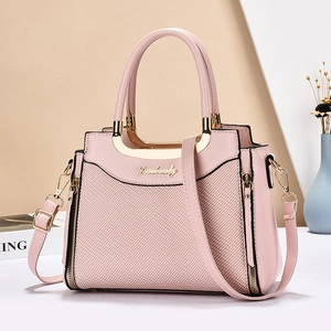 Pink faux leather handbag for women featuring woven texture and gold metal handles