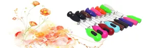 Macro view of handheld electric milk frother handles in various vibrant plastic colors