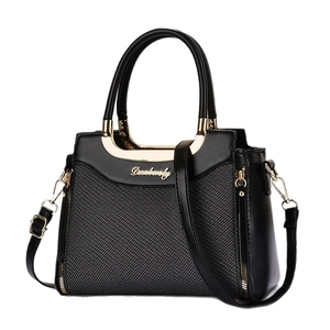 Elegant black faux leather trapezoid handbag with woven texture and gold-tone hardware