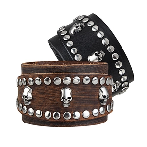 Men's wide punk leather bracelet set with metallic skulls and rivets in black and brown