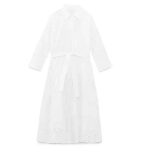 Elegant white long sleeve dress with intricate eyelet embroidery and a waist tie
