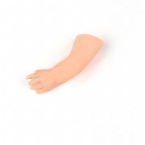 Detailed close-up of a realistic miniature soft PVC hand prop for magic coin tricks