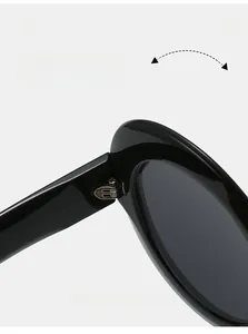 Vue macro de la charnière métallique renforcée sur les lunettes de soleil ovales tendance