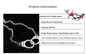 Detailed close-up of Freedom engraved silver handcuff necklace and bracelet set