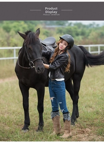 Outdoor view of equestrian gear featuring brown patterned boots and riding attire