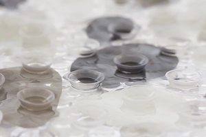 Macro view of non-slip bath mat suction cups and pebble texture in grey and white