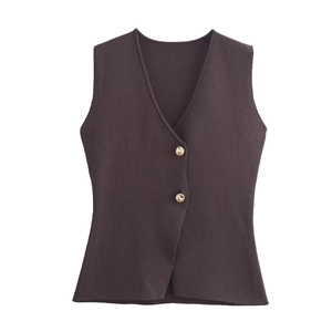 Close-up of deep coffee knit vest with V-neck and decorative gold-toned buttons