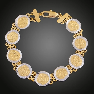 Macro di bracciale bicolore in oro e argento con maglie circolari e motivi a rilievo