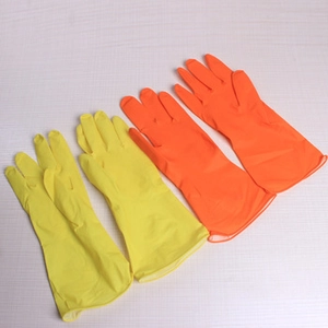 Flat lay view of long yellow and orange rubber gloves for household cleaning and protection