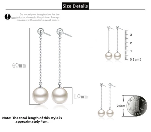 Macro shot showing 40mm length of long pearl tassel earrings with size reference coin