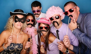 Group photo showing fun bride to be wedding photo props and pink wig on blue background
