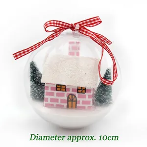 Transparent 10cm Christmas ball ornament with pink miniature house and festive trees inside