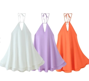 Three elegant halter neck dresses in white, lilac, and orange with tiered A-line skirts