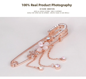 Detail of rose gold flower brooch with opal petals, crystal accents and tassel chains
