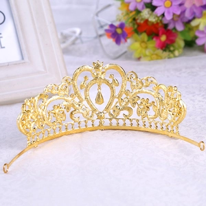 Detail of golden heart-shaped baroque tiara with alloy metalwork and waterdrop pendants