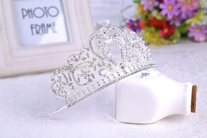 Close-up of a silver baroque crown featuring intricate alloy rhinestones and heart design