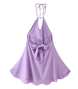 Detail of lavender halter dress featuring open back with elegant bow and tiered ruffle hem
