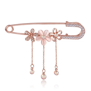 Elegant rose gold flower brooch with pink cat eye stone and dangling crystal charms