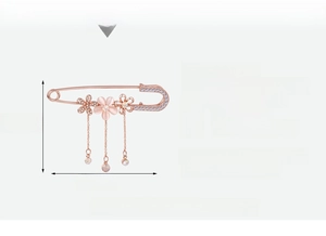 Detailed view of rose gold floral brooch with pink cat eye stone and sparkling crystals