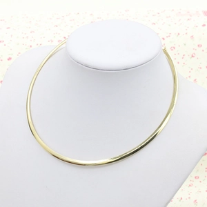 Punk style metallic gold choker necklace for women displayed on a white neck mannequin