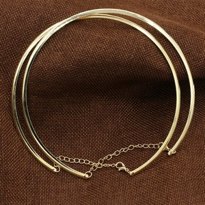 Detailed close-up of double-layered gold punk choker with adjustable lobster clasp chain