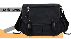 Close-up of dark grey canvas messenger bag featuring flap cover and dual buckle closure
